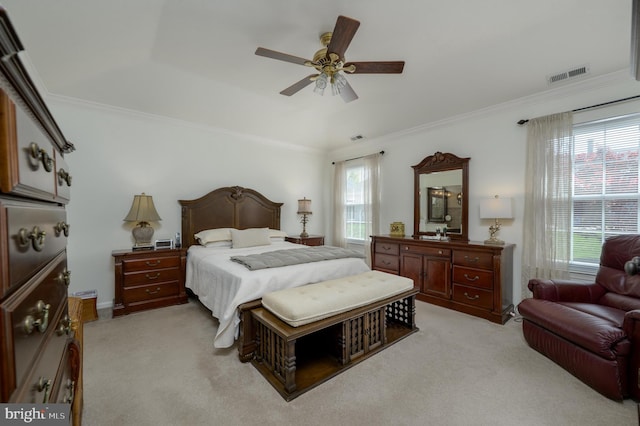 bedroom featuring visible vents, crown molding, and light colored carpet