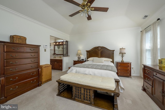 bedroom with visible vents, ornamental molding, a tray ceiling, and light carpet