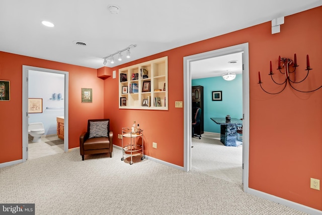 sitting room with carpet, an office area, and baseboards