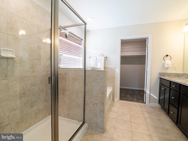 9318 Sydney Way, Laurel, MD 20723 - full bath with vanity, tile patterned floors, a spacious closet, a bath, and a stall shower