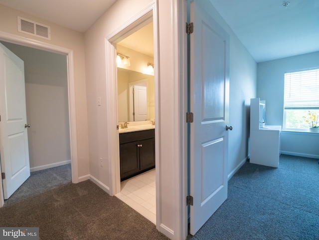 9318 Sydney Way, Laurel, MD 20723 - hall featuring a sink, baseboards, light carpet, and visible vents