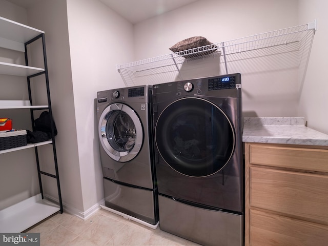 9318 Sydney Way, Laurel, MD 20723 - washroom featuring light tile patterned floors, baseboards, laundry area, and washer and dryer