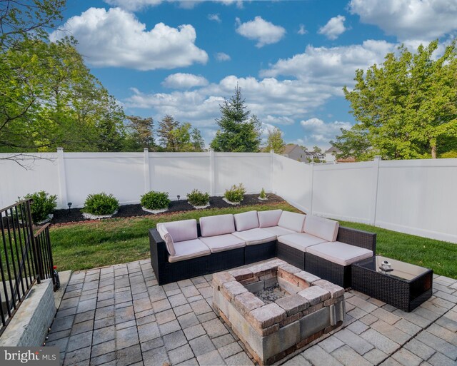 9318 Sydney Way, Laurel, MD 20723 - view of patio / terrace with a fenced backyard and an outdoor living space with a fire pit
