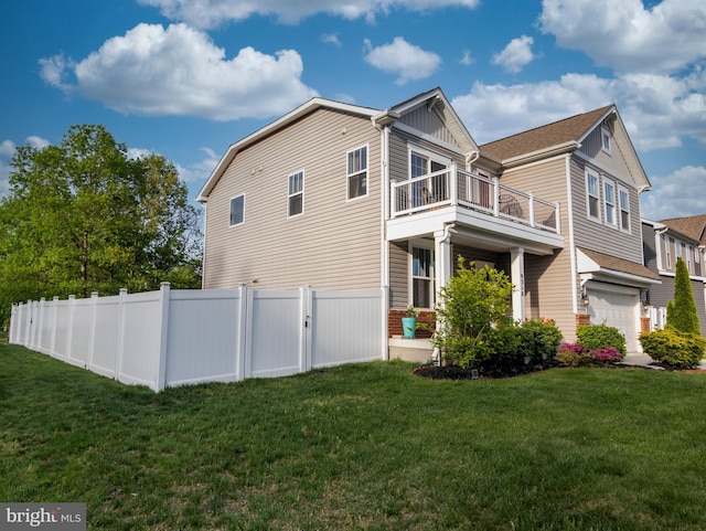 9318 Sydney Way, Laurel, MD 20723 - view of property exterior featuring a lawn, fence, a balcony, and a garage