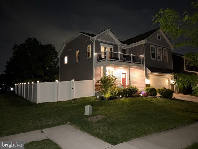 9318 Sydney Way, Laurel, MD 20723 - view of front of home with fence, an attached garage, a lawn, and a balcony