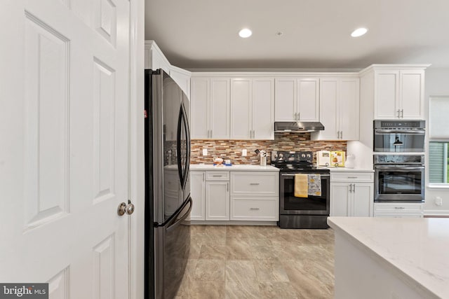 213 Denison St, Fredericksburg, VA 22406 - kitchen with recessed lighting, decorative backsplash, under cabinet range hood, appliances with stainless steel finishes, and white cabinets