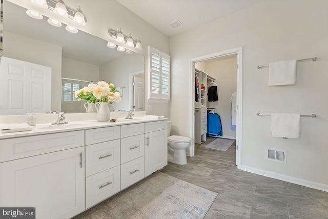 213 Denison St, Fredericksburg, VA 22406 - full bath with plenty of natural light, double vanity, a sink, visible vents, and a stall shower