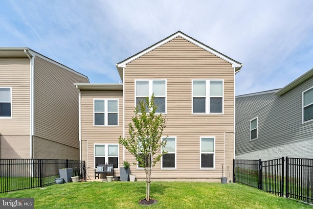 213 Denison St, Fredericksburg, VA 22406 - back of house with a fenced backyard and a lawn