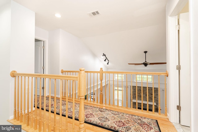 189 Potomac Crossing St, Charles Town, WV 25414 - corridor with an upstairs landing, track lighting, vaulted ceiling, wood finished floors, and recessed lighting