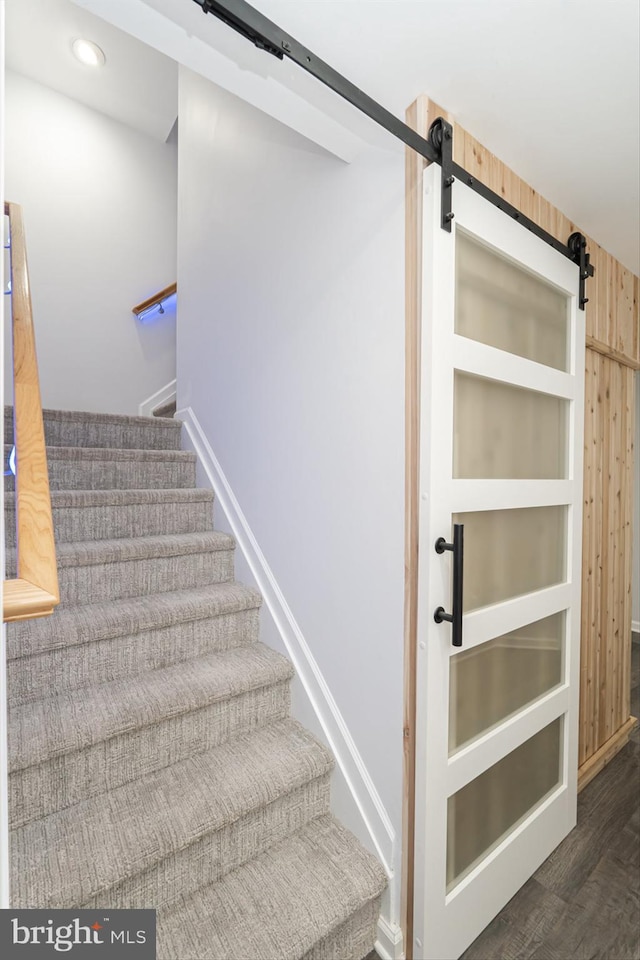 189 Potomac Crossing St, Charles Town, WV 25414 - staircase with a barn door, baseboards, and wood finished floors