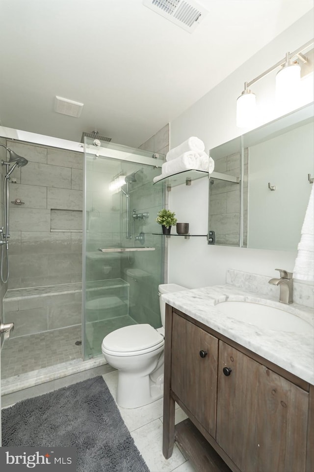 189 Potomac Crossing St, Charles Town, WV 25414 - bathroom featuring vanity, toilet, a shower stall, and tile patterned flooring