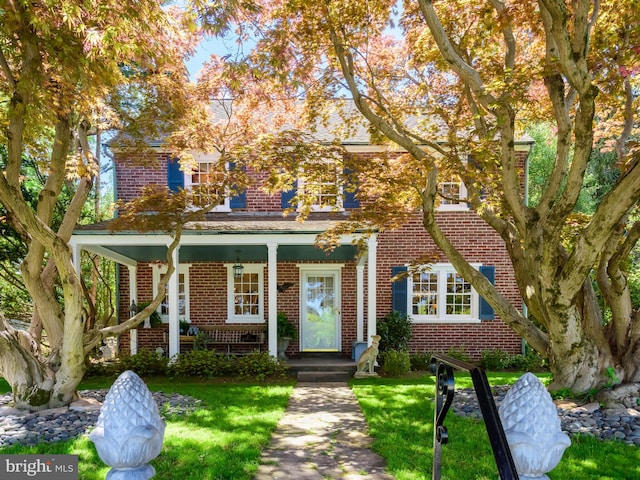 27 Dogwood Dr, Kennett Square, PA 19348 - view of front of home featuring brick siding and a front lawn
