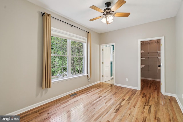24 Monument Dr, Stafford, VA 22554 - unfurnished bedroom featuring baseboards, a spacious closet, light wood-type flooring, visible vents, and a closet