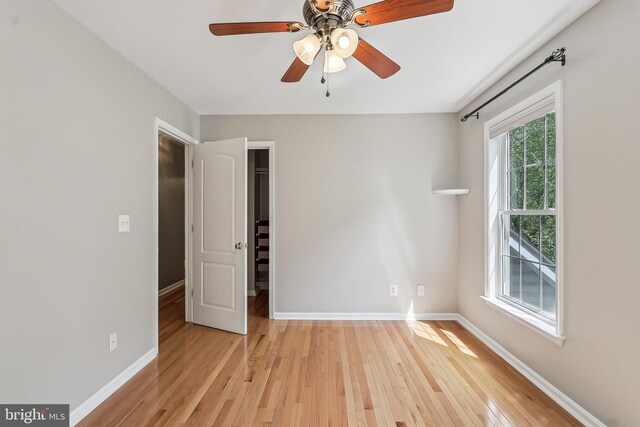 24 Monument Dr, Stafford, VA 22554 - unfurnished bedroom with a ceiling fan, light wood-type flooring, baseboards, a closet, and a spacious closet