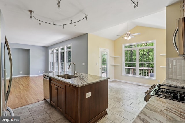 24 Monument Dr, Stafford, VA 22554 - kitchen with ceiling fan, light stone countertops, a sink, open floor plan, and stainless steel appliances