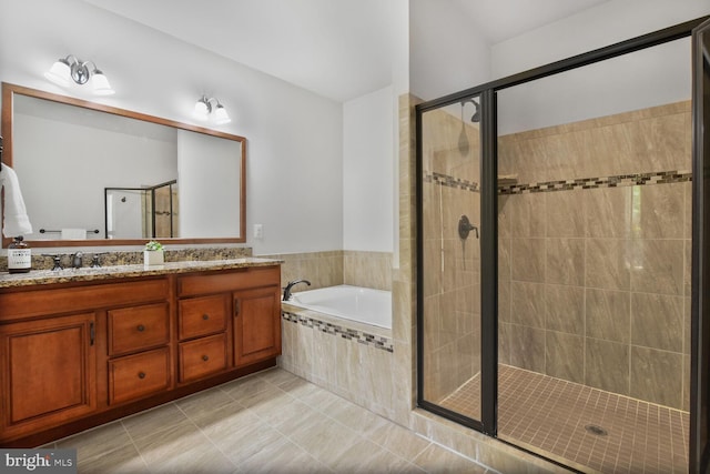 bathroom with a garden tub, a stall shower, tile patterned flooring, and double vanity