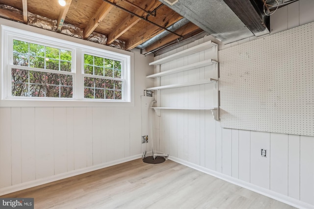interior space with baseboards and wood finished floors