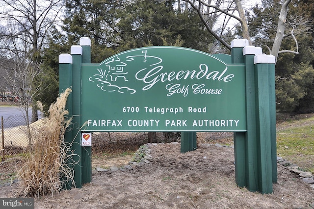 community sign featuring fence