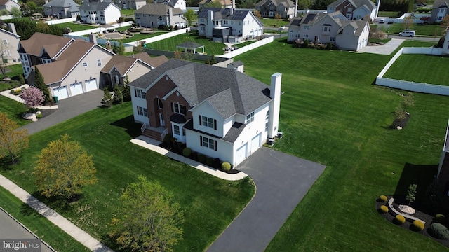 birds eye view of property with a residential view