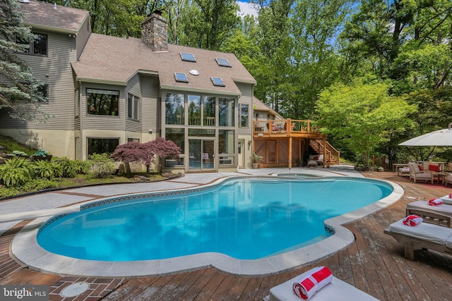 3 Hickory Ln, Chadds Ford, PA 19317 - swimming pool featuring a wooden deck, stairway, and view of wooded area