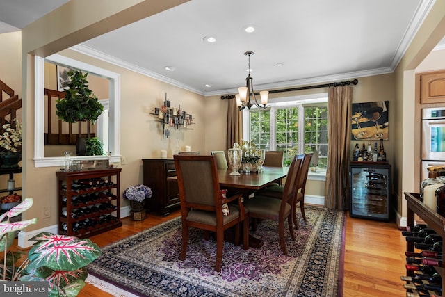 3 Hickory Ln, Chadds Ford, PA 19317 - dining room featuring wine cooler, light wood-style floors, crown molding, a chandelier, and baseboards