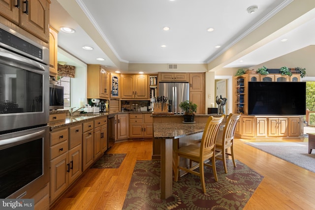 3 Hickory Ln, Chadds Ford, PA 19317 - kitchen featuring stainless steel appliances, a breakfast bar, healthy amount of natural light, a center island, and crown molding