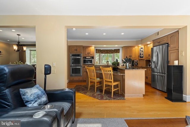 3 Hickory Ln, Chadds Ford, PA 19317 - living room with healthy amount of natural light, crown molding, a chandelier, light wood finished floors, and recessed lighting
