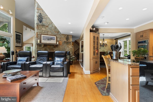 3 Hickory Ln, Chadds Ford, PA 19317 - living room featuring light wood-style flooring, crown molding, and a chandelier