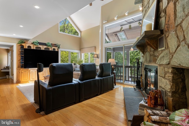 3 Hickory Ln, Chadds Ford, PA 19317 - living room with a fireplace, light wood finished floors, high vaulted ceiling, and baseboards