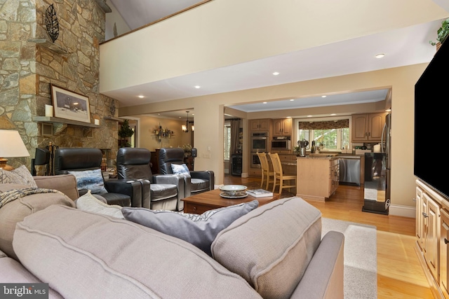 3 Hickory Ln, Chadds Ford, PA 19317 - living area with light wood-style flooring, a fireplace, baseboards, and recessed lighting