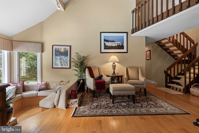 3 Hickory Ln, Chadds Ford, PA 19317 - sitting room featuring high vaulted ceiling, wood-type flooring, stairs, and track lighting