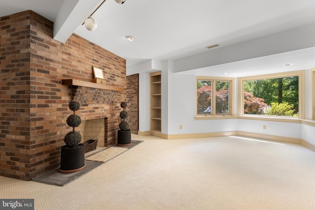 3 Hickory Ln, Chadds Ford, PA 19317 - unfurnished living room with carpet floors, baseboards, a fireplace, and track lighting