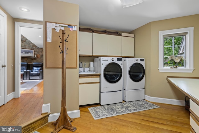 3 Hickory Ln, Chadds Ford, PA 19317 - clothes washing area with cabinet space, washing machine and dryer, light wood finished floors, and baseboards