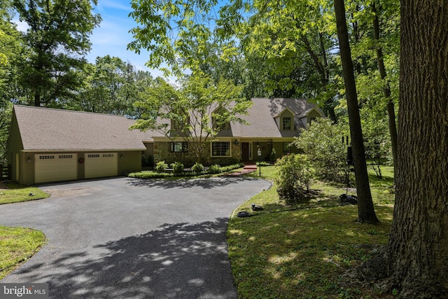 3 Hickory Ln, Chadds Ford, PA 19317 - cape cod-style house featuring asphalt driveway, a garage, and roof with shingles