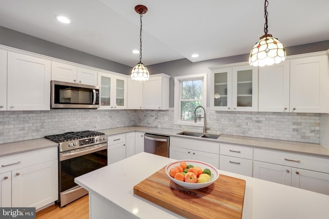 2314 Apple Hill Rd, Alexandria, VA 22308 - kitchen featuring white cabinetry, appliances with stainless steel finishes, and a sink