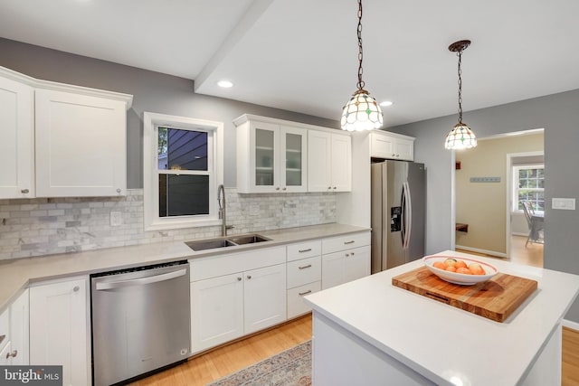 2314 Apple Hill Rd, Alexandria, VA 22308 - kitchen featuring recessed lighting, stainless steel appliances, backsplash, a sink, and light wood-type flooring