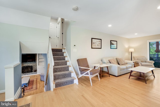 2314 Apple Hill Rd, Alexandria, VA 22308 - living area featuring recessed lighting, wood finished floors, stairs, a fireplace, and baseboards