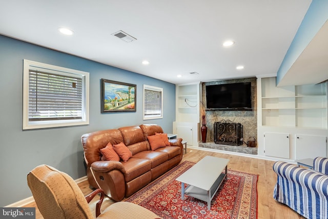 2314 Apple Hill Rd, Alexandria, VA 22308 - living area with a large fireplace, visible vents, baseboards, recessed lighting, and wood finished floors