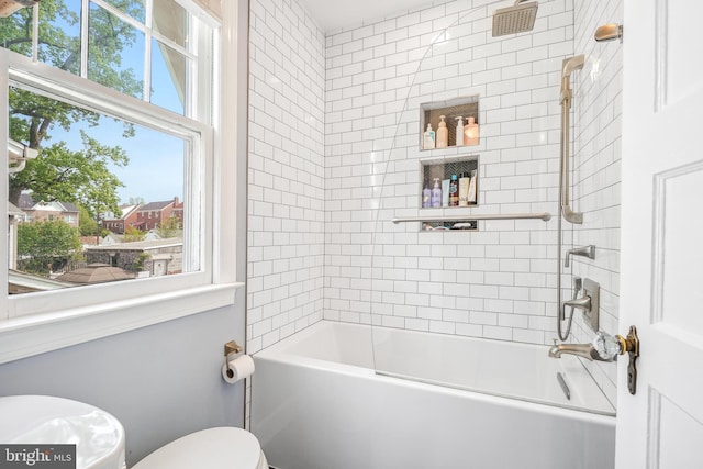 full bathroom featuring washtub / shower combination and toilet