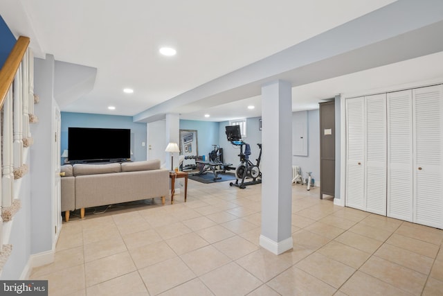 living room with light tile patterned floors and recessed lighting