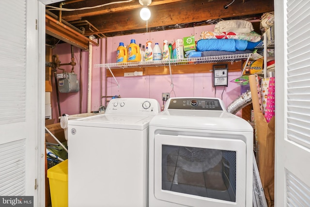 washroom with independent washer and dryer and laundry area