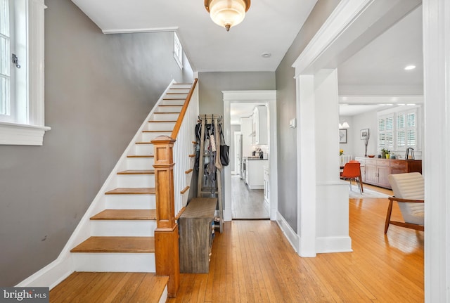 interior space featuring baseboards and hardwood / wood-style floors