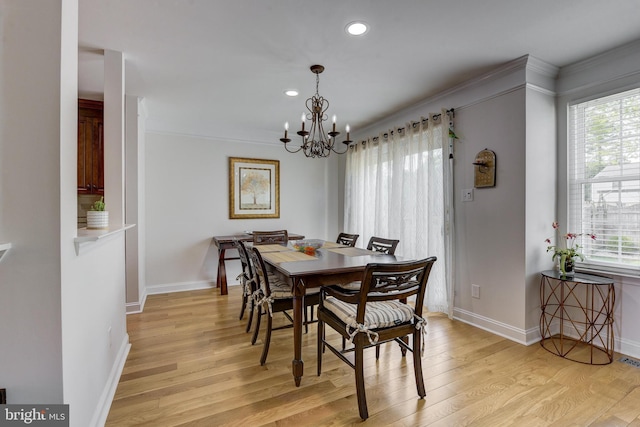 dining area featuring a chandelier, plenty of natural light, recessed lighting, and light wood-style floors