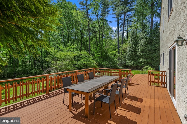 deck featuring outdoor dining space
