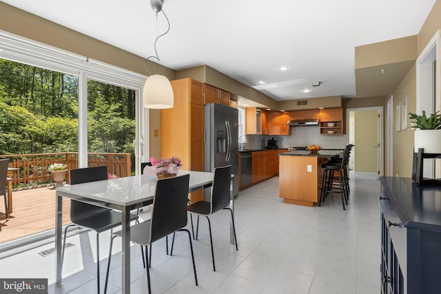 dining room featuring recessed lighting and light tile patterned floors