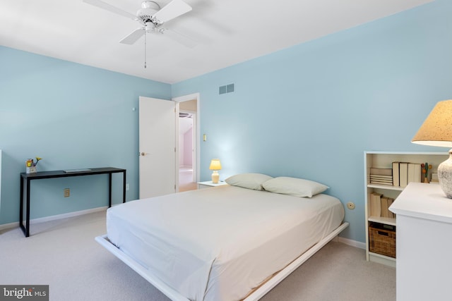 bedroom with carpet floors, baseboards, and a ceiling fan