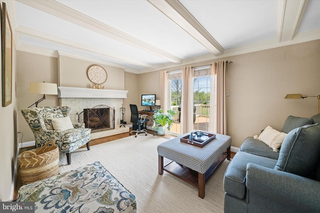 living area with crown molding, a brick fireplace, wood finished floors, beam ceiling, and baseboards