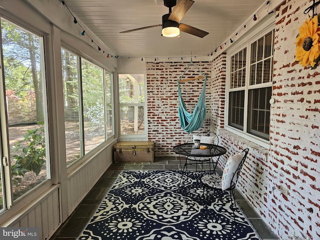 sunroom / solarium with ceiling fan