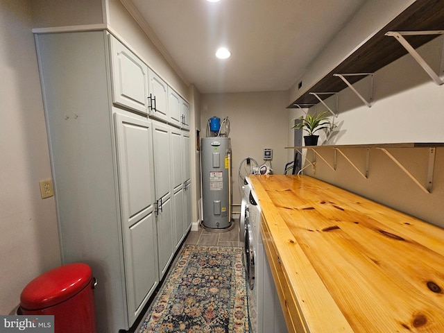 interior space featuring washer and clothes dryer and water heater