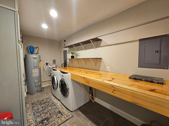 laundry area with independent washer and dryer, laundry area, water heater, recessed lighting, and electric panel